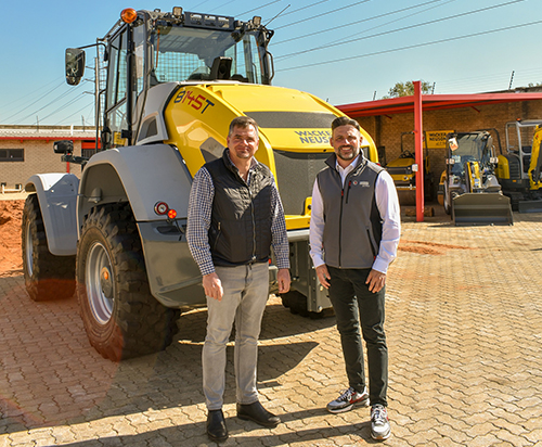 Dennis Vietze right and Stefan le Roux in front of the new 8145T Loader in the test pit at Wacker Neuson South Africa HQ in Robertville JHB